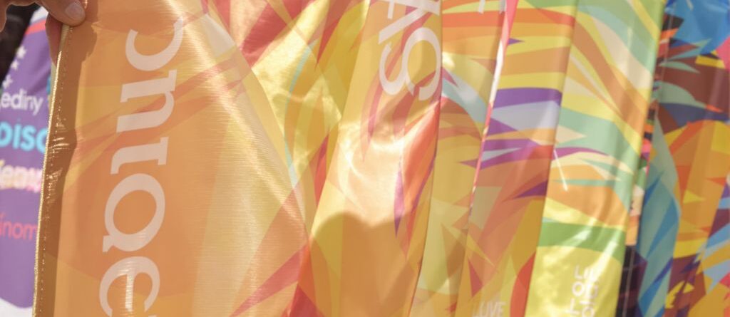 Colorful personalized banners fluttering in a breeze.