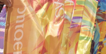 Colorful personalized banners fluttering in a breeze.