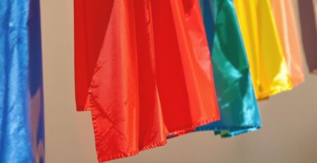 Colorful banners fluttering in a sunlit breeze.