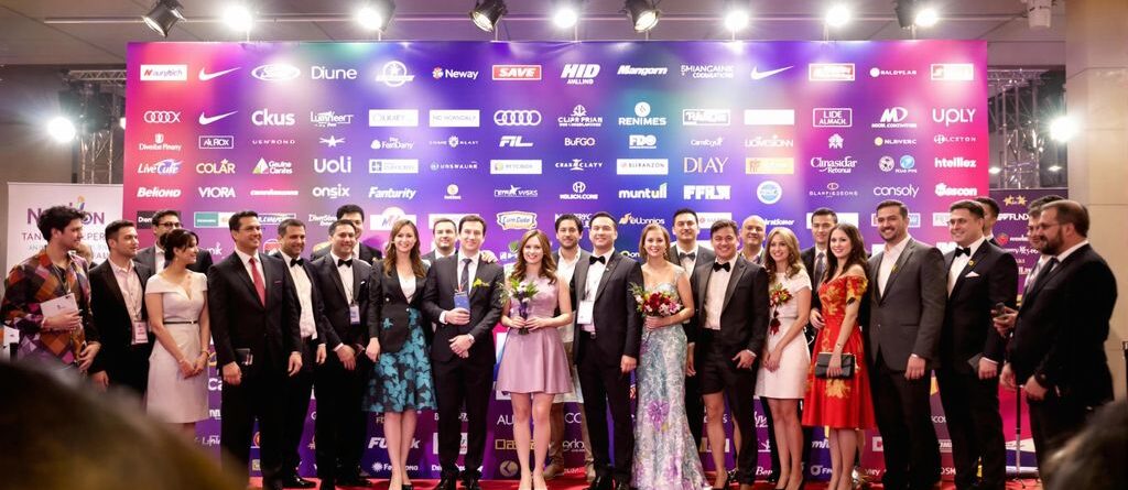 Red carpet event with a custom banner.