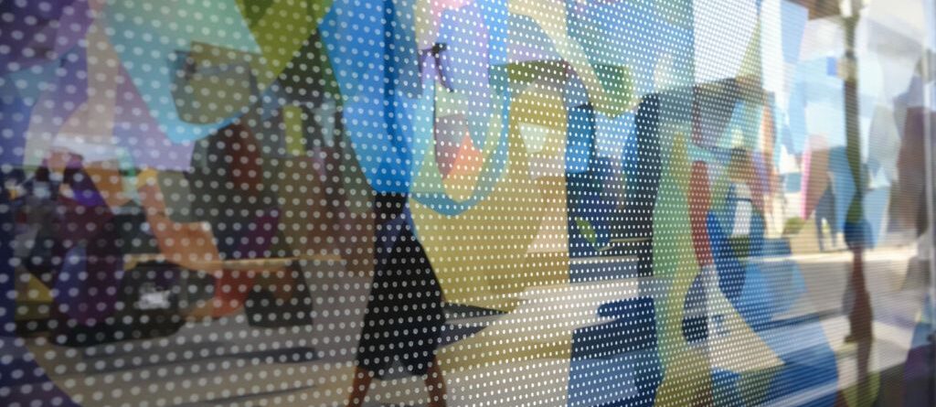 Storefront window with a vibrant graphic