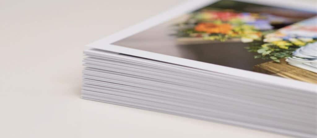 A stack of 4x6 photo prints.