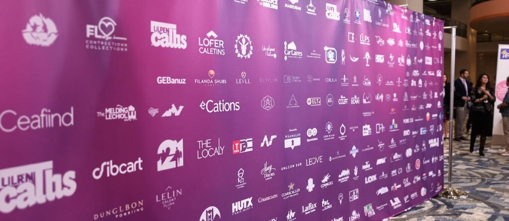 Custom step and repeat banner, branded event backdrop.