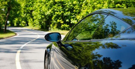 Car driving on road with blurred background