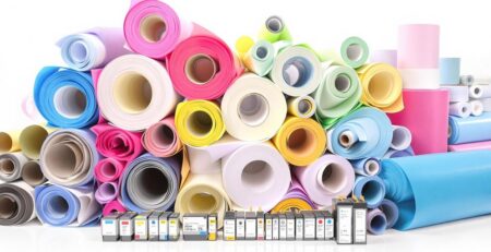 Rolls of colorful paper and ink cartridges.