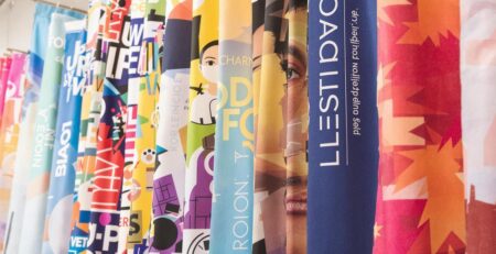 Colorful banners, various sizes, displayed indoors.