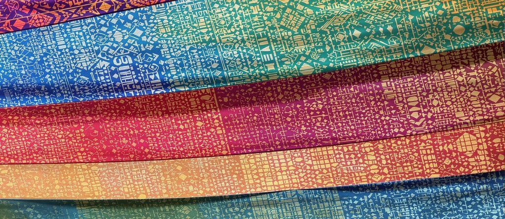 Colorful patterned banners flowing in wind.