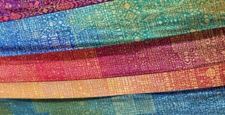 Colorful patterned banners flowing in wind.