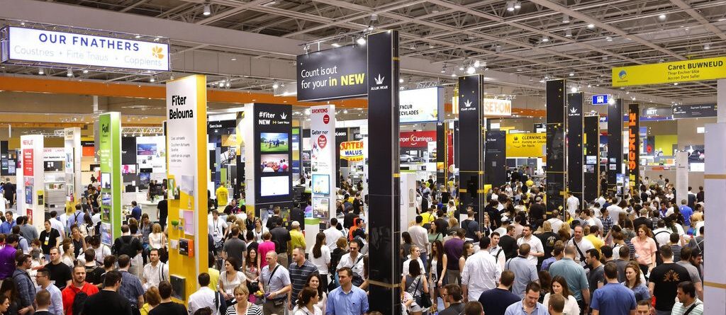 People interacting with retractable banners at an event.