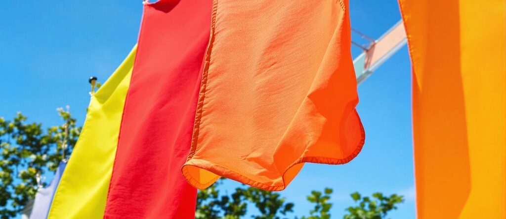 Colorful banners flapping in gentle breeze.