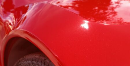 Glossy red car, sleek, professional 3M auto wrap