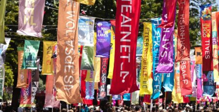 Colorful banners fluttering outdoors at an event.