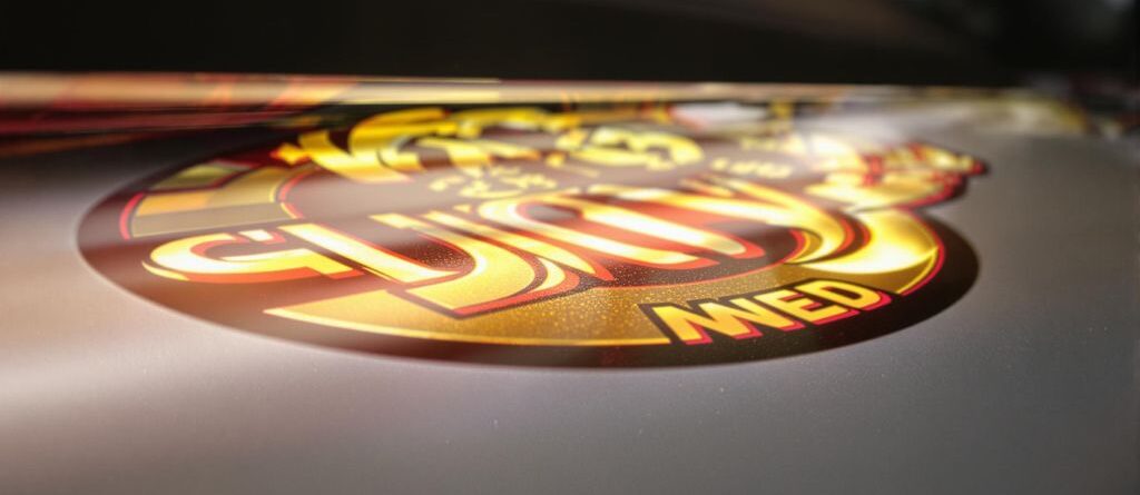 Glowing business logo on a vivid backlit decal.