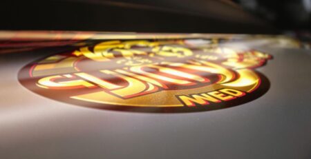 Glowing business logo on a vivid backlit decal.