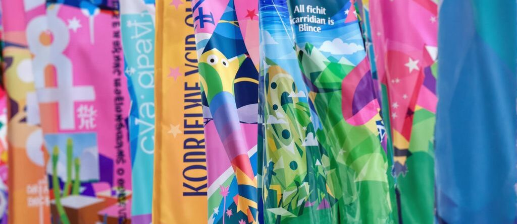 Colorful banners fluttering outdoors.