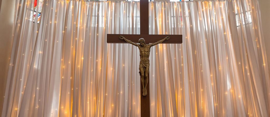Beautiful church event backdrop with light and fabric.