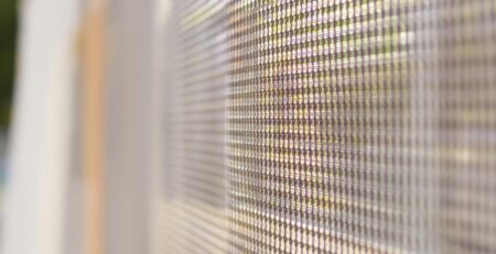 Mesh banner fluttering outdoors in sunlight.
