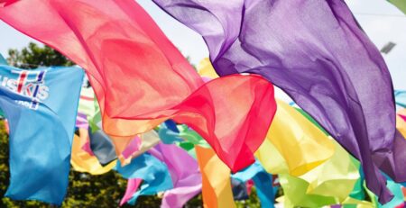 Colorful banners fluttering in a vibrant outdoor setting.