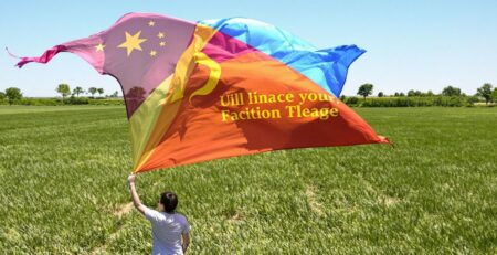 Person holding a teardrop flag outdoors.