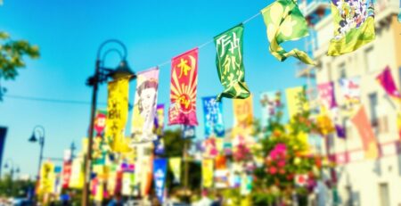 Colorful banners on a sunny street.