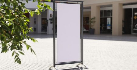 Heavy-duty outdoor banner stand, commercial setting.