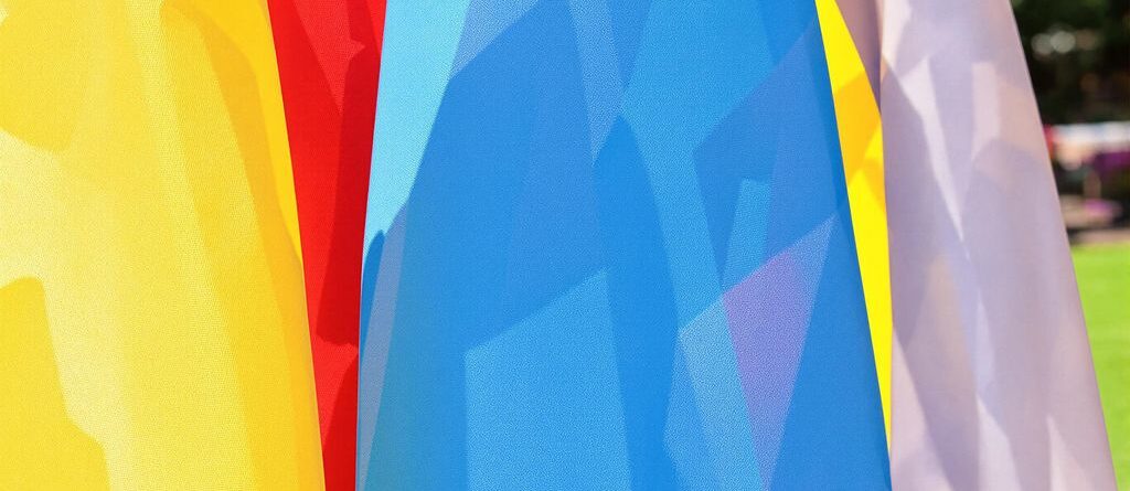 Colorful fabric blowing in outdoor breeze.